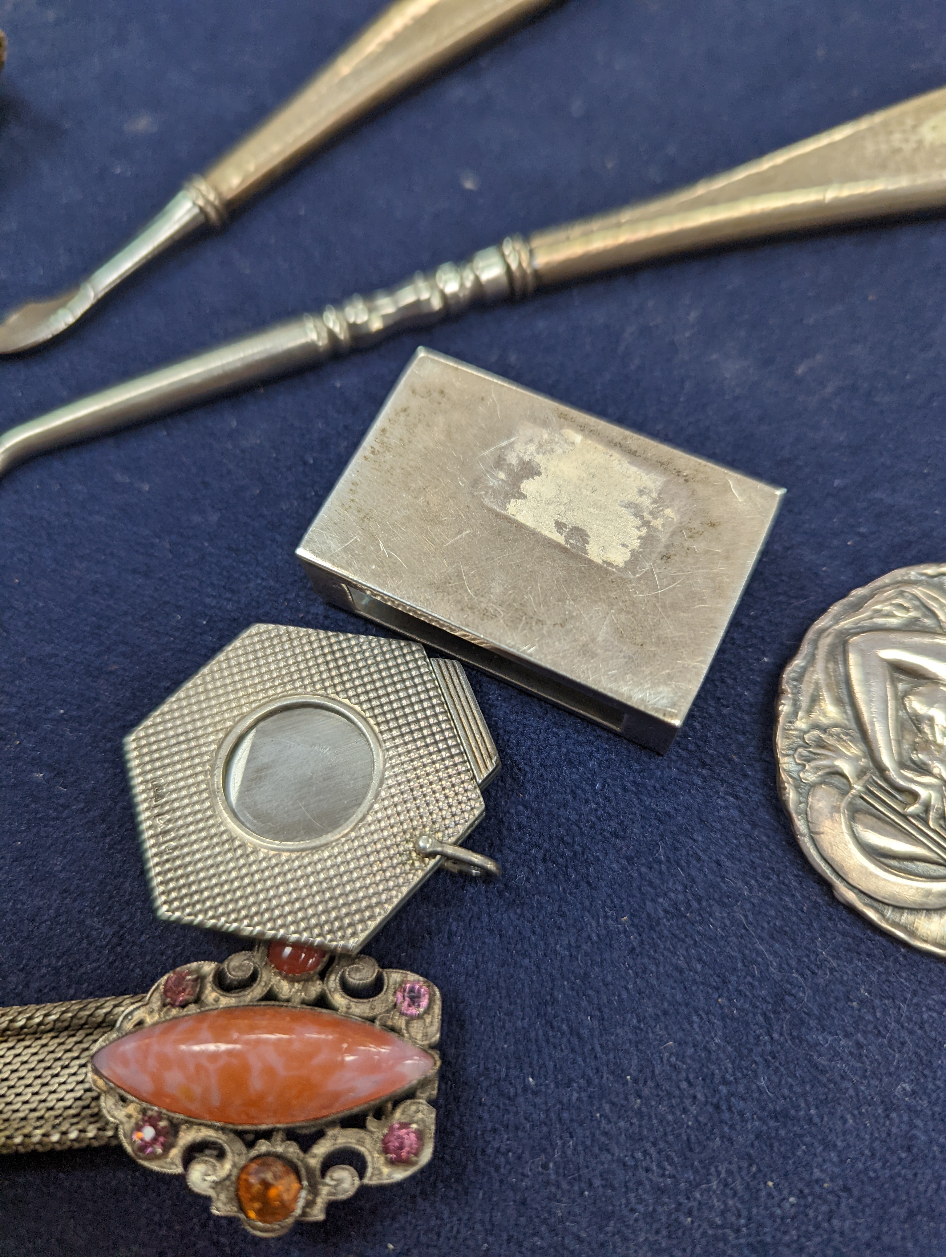 A cased Victorian engraved gilt white metal and coral set double ended scent bottle, 13.4cm, a silver cigar cutter, a belt, a silver buckle, gilt and cranberry perfume bottle, etc.